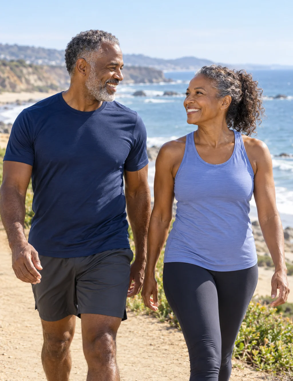 AI-generated illustration of a fit couple with gray hair walking along a coastal path